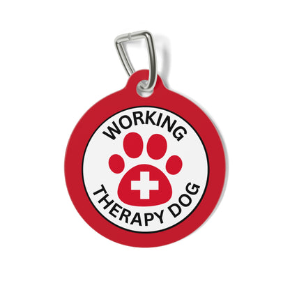 Red personalized Working Therapy Dog ID tag featuring a paw print medical symbol on the front and custom contact information on the back
