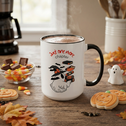 Ceramic Halloween accent mug featuring a ghost wearing a witch hat surrounded by books and bats with the phrase "Just One More Chapter," available in orange and black accent colors in 11oz and 15oz sizes.